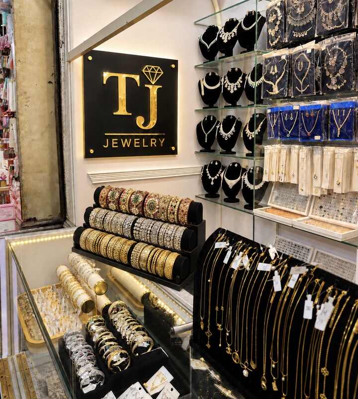 TJ Jewelry shop display with jewellery and the shop logo