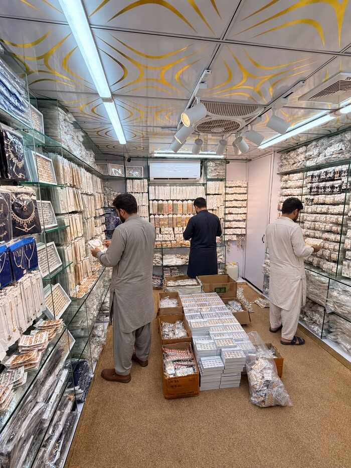 Wholesale buyers selecting jewellery inside TJ Jewelry